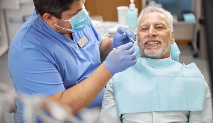 senior-patient-having-a-dental-treatment-at-the-cl-2023-11-27-05-37-14-utc-scaled.jpg